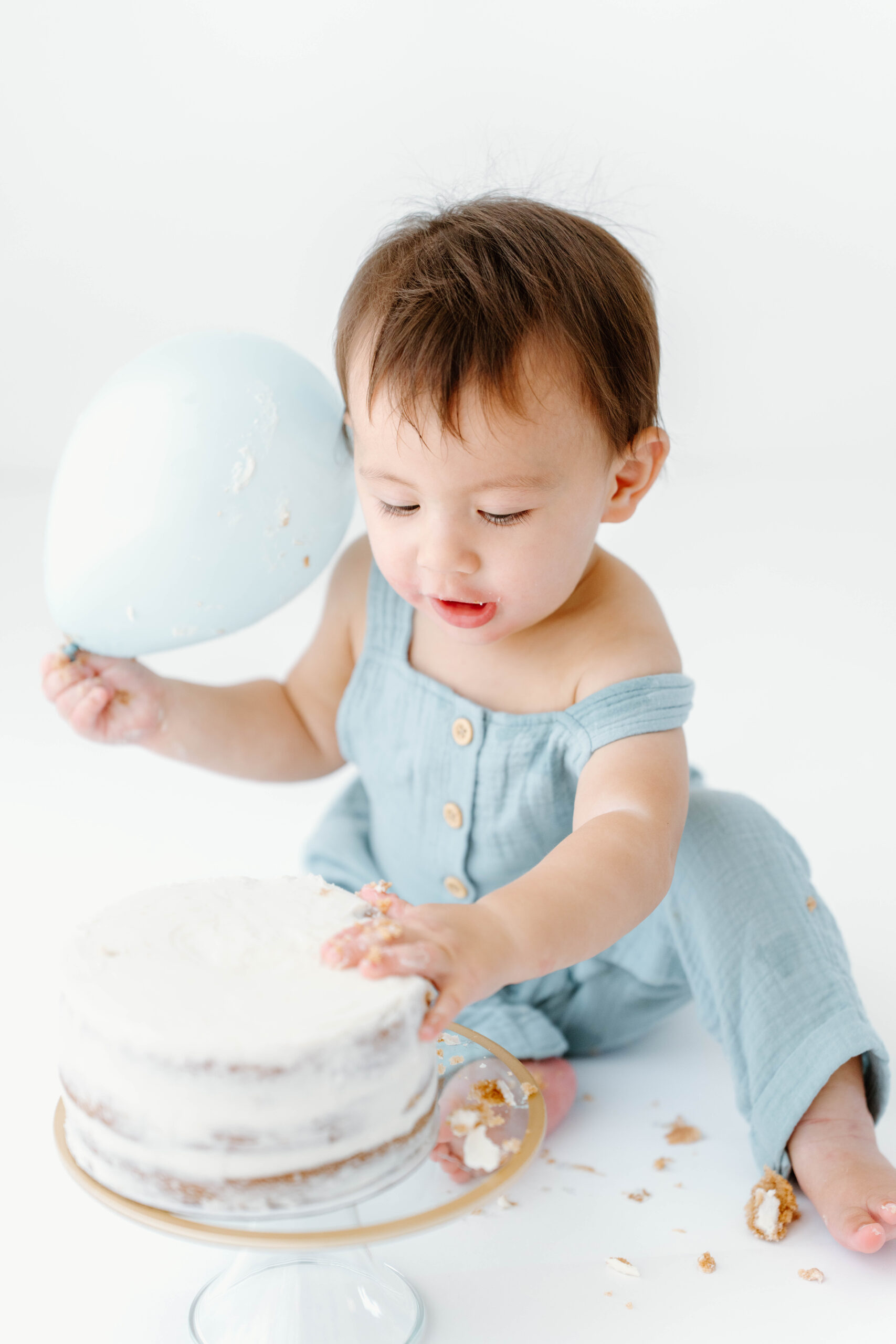 Zachary digs into his smash cake