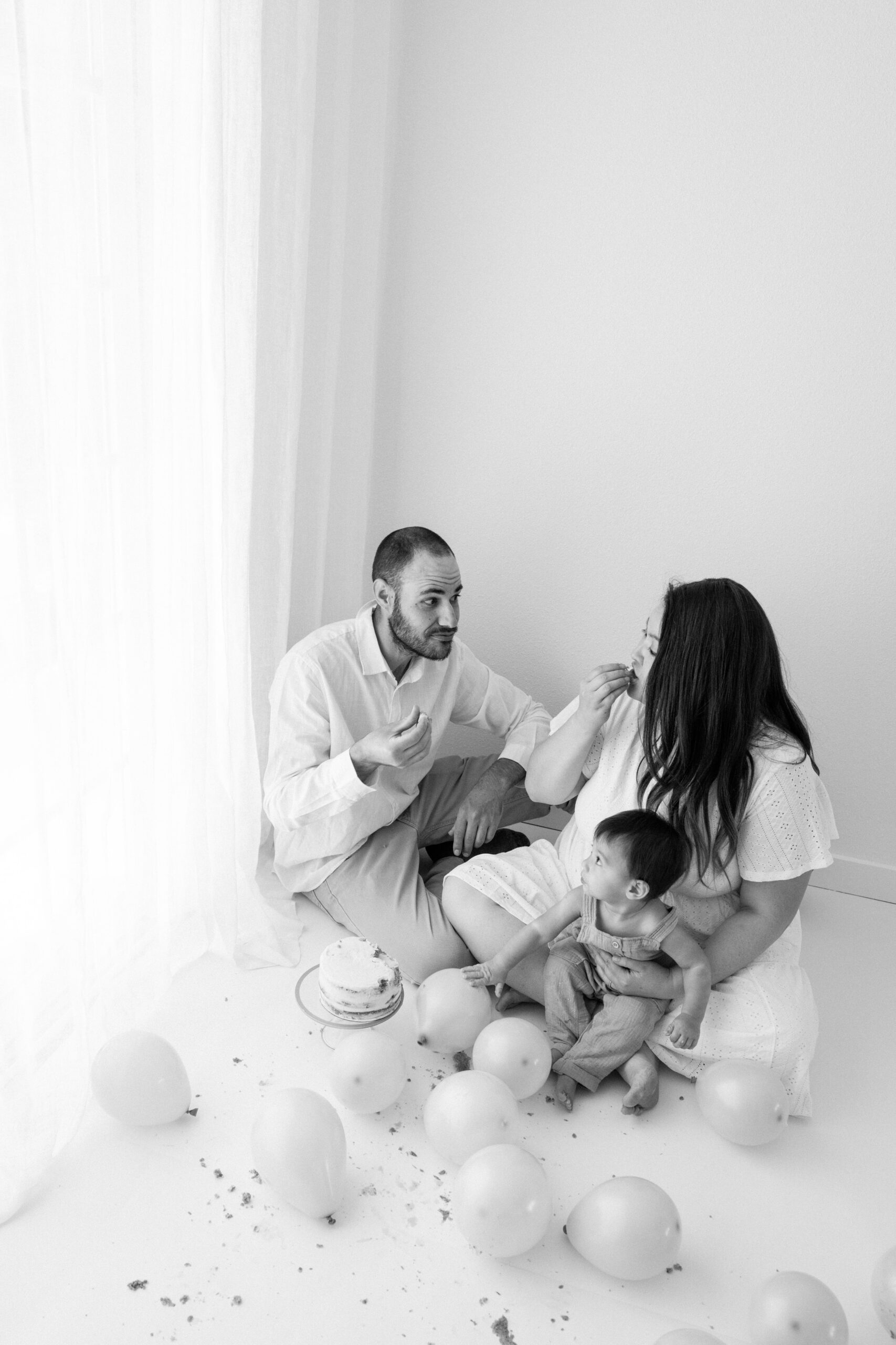 Black-and-white photo of the family celebrating Zachary's first birthday