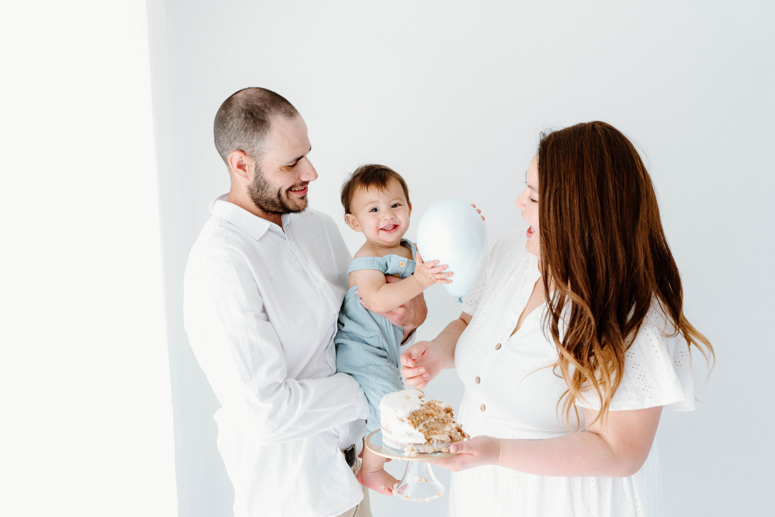 Zachary's parents laugh with him in the studio