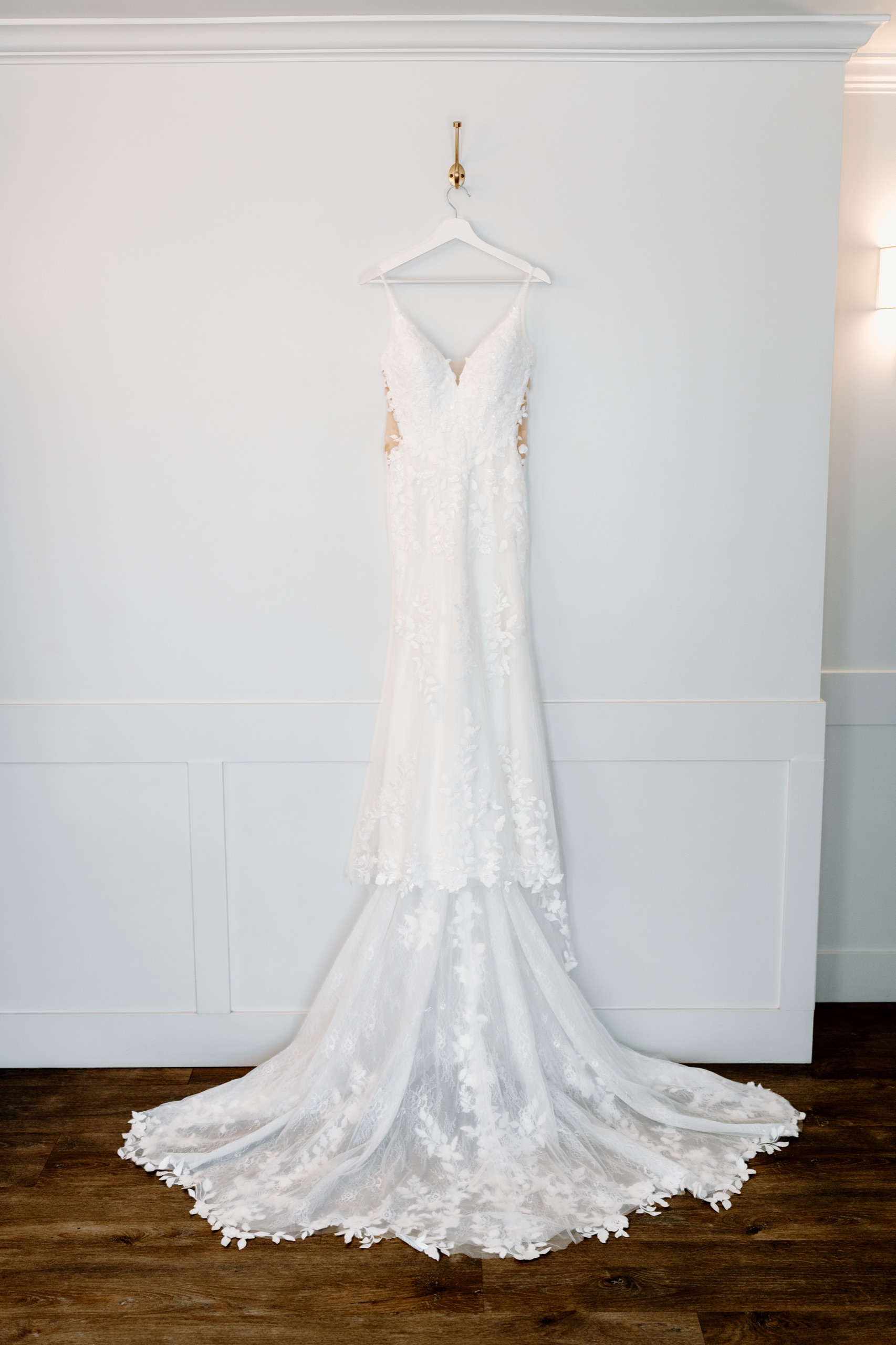 Jane’s lace wedding gown hanging in the bridal suite at Mountain Meadows