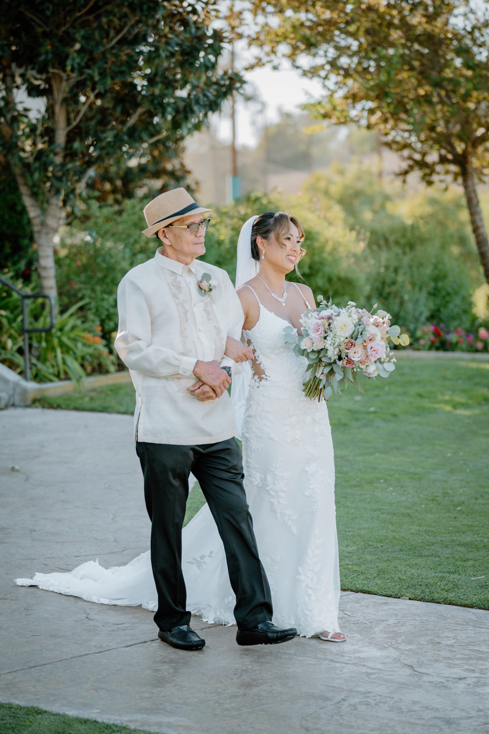 Jane walking arm in arm toward the ceremony